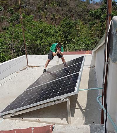 A man and solar panels